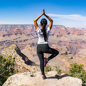 Woman practicing yoga outdoors