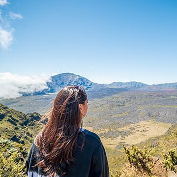 Woman viewing crater