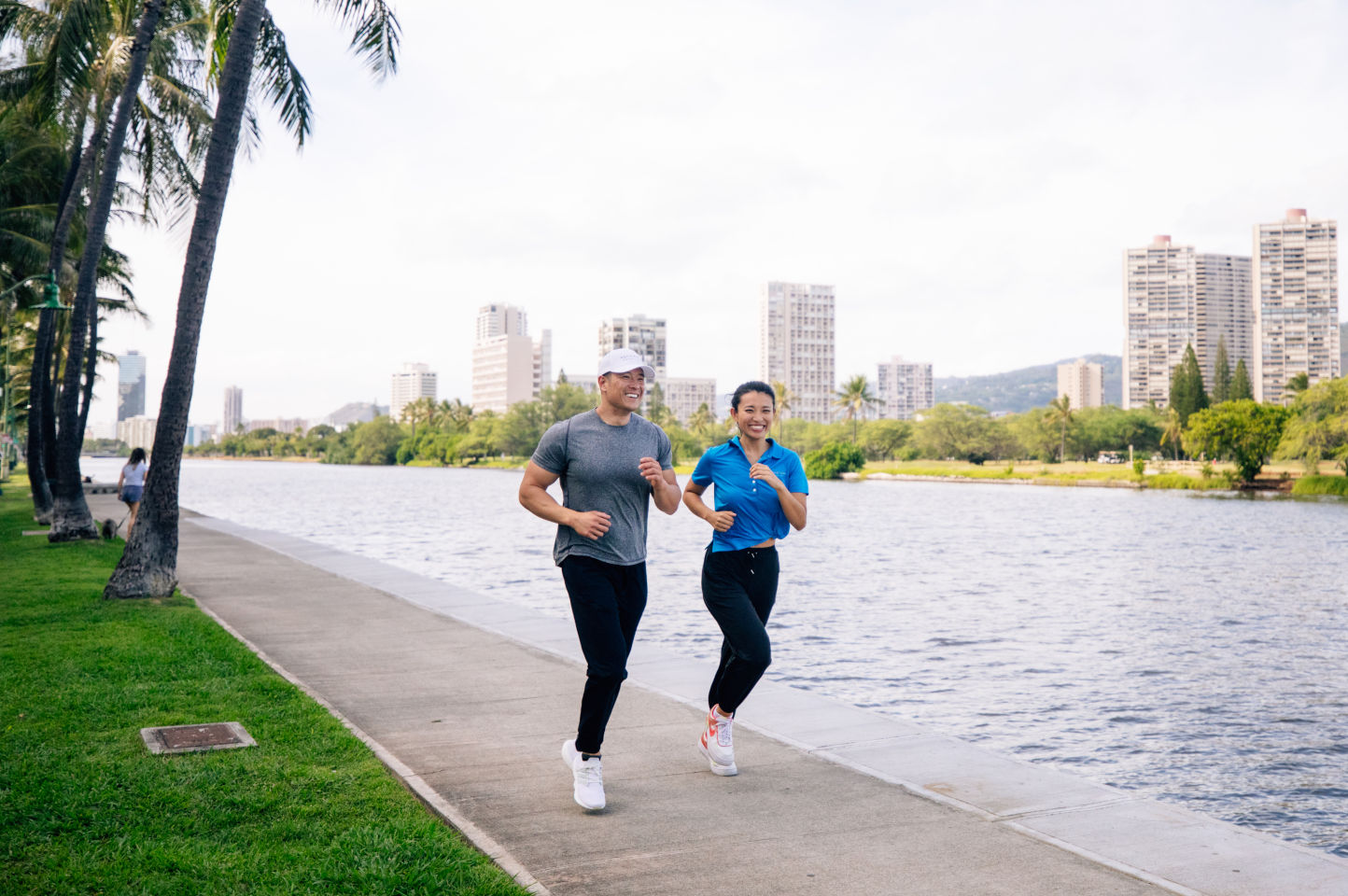 Couple jogging along the Ala Wai Canal near the hotel.