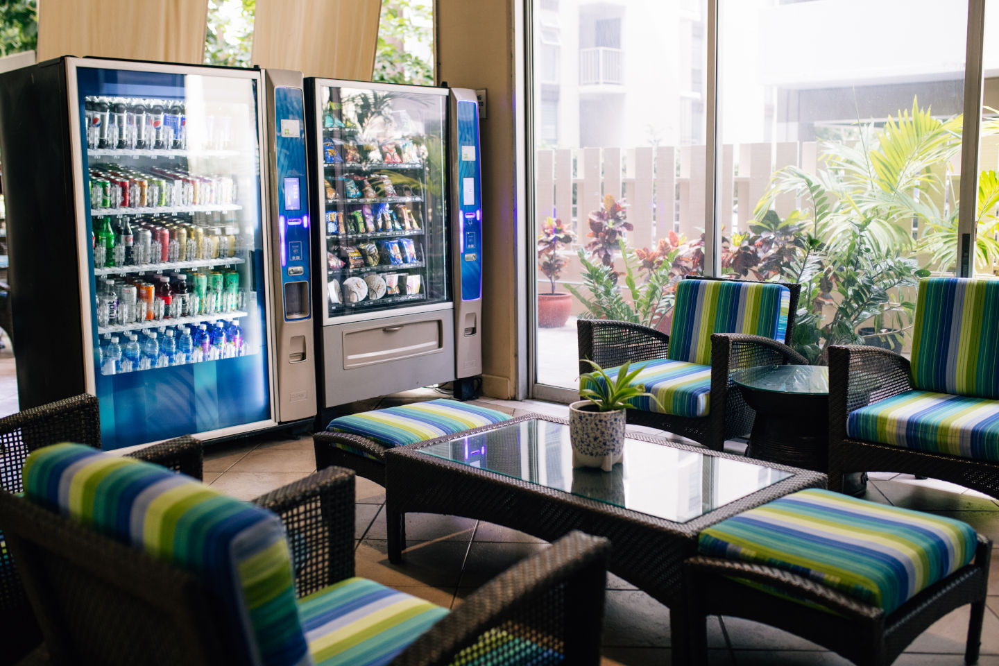 Vending machines and seating area in hotel lobby.