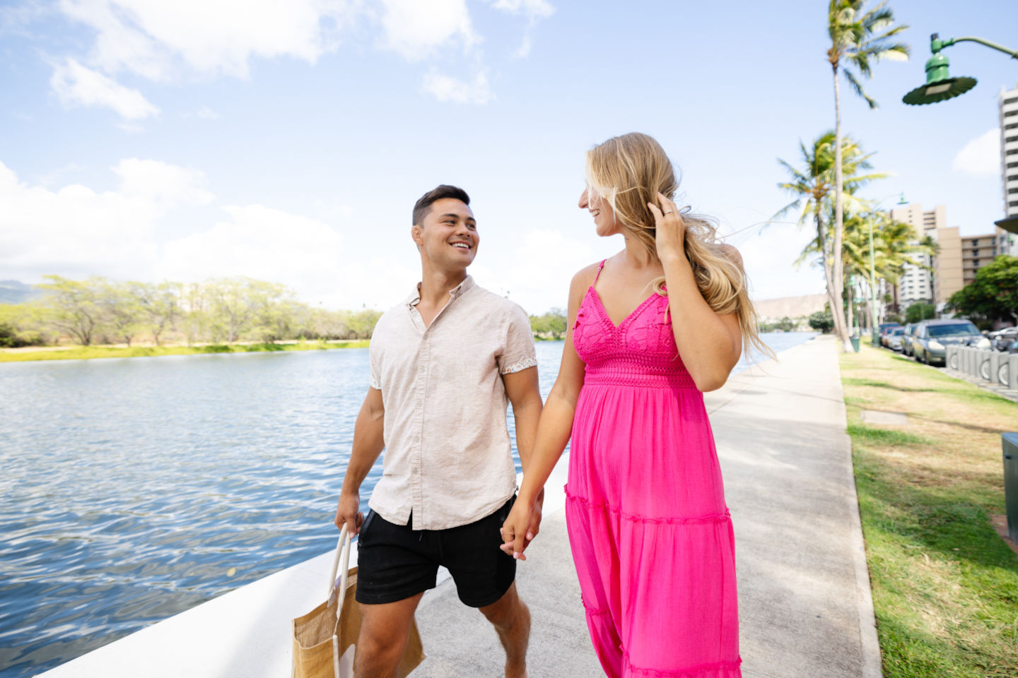 Couple walking along Ala Wai Canal near the hotel.