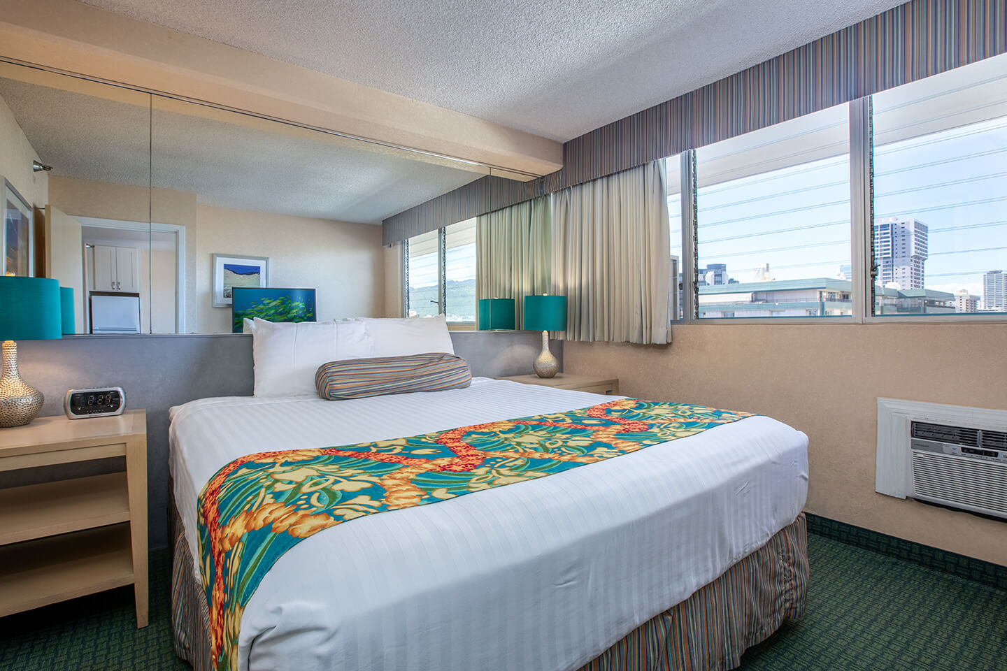 Room with a bed, nightstand, and lamp.