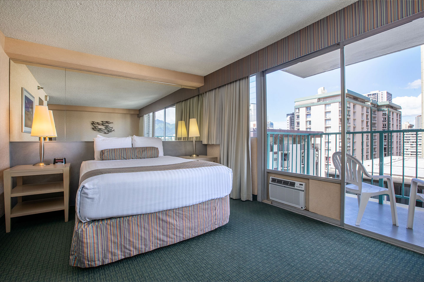 Room with a bed and balcony.