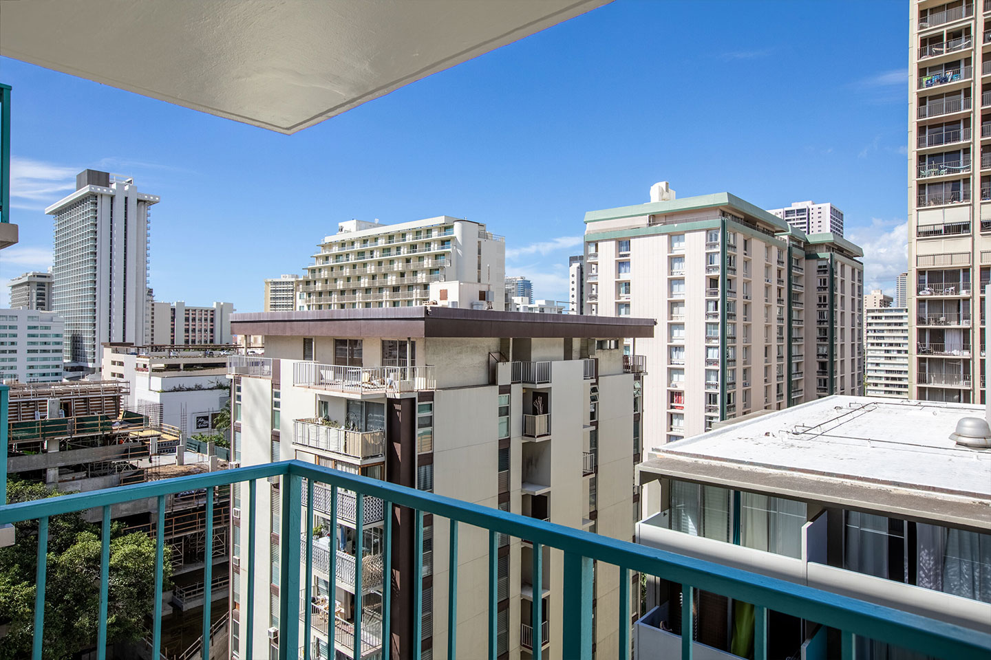  Balcony view of buildings and city skyline.