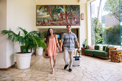 Couple walking through hotel lobby