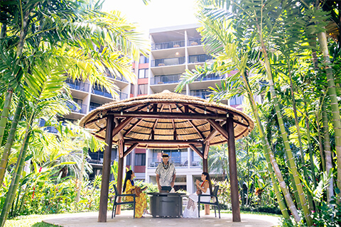 Small group of people in garden gazebo