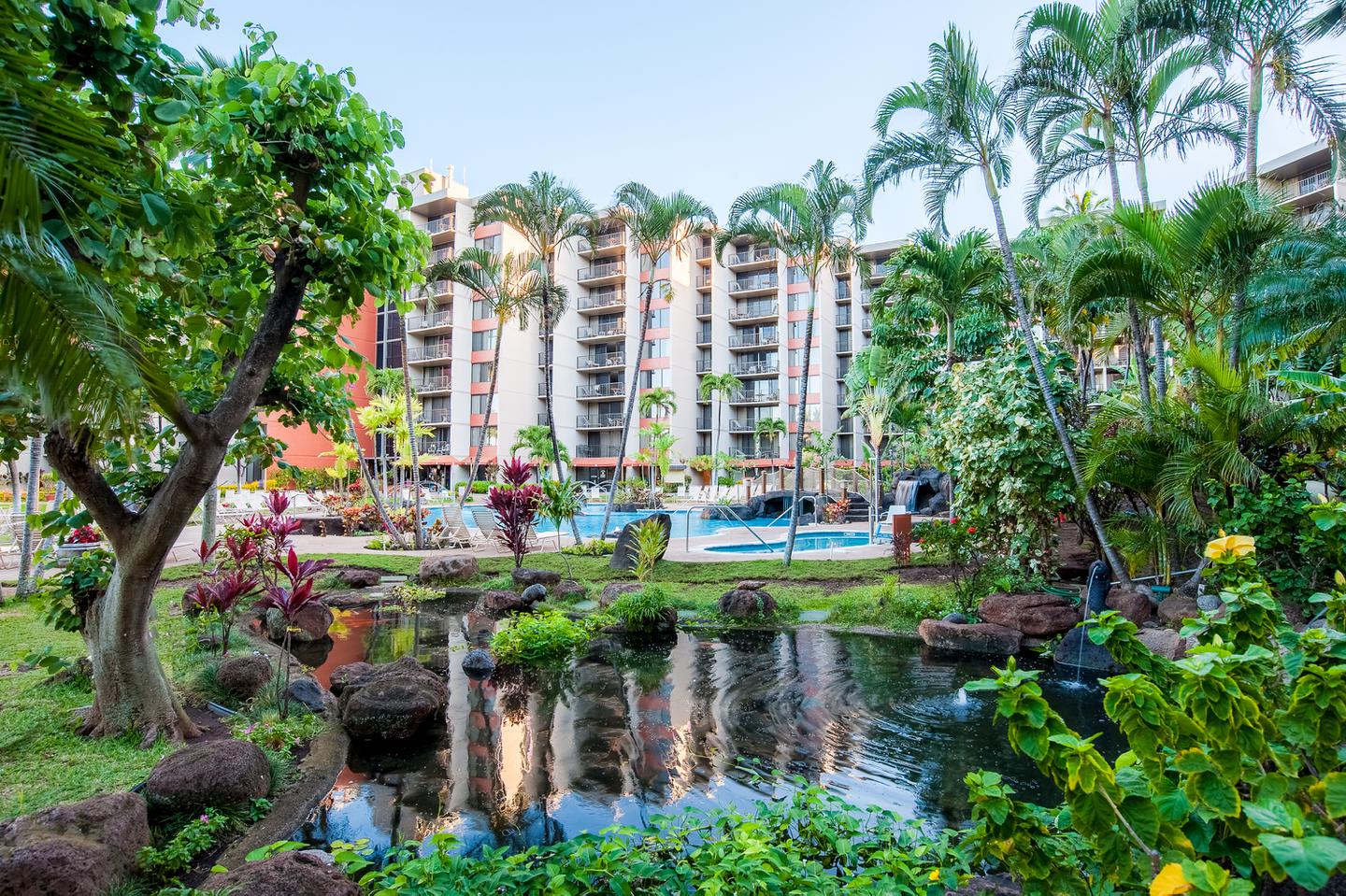 Resort gardens, pool, and exterior.