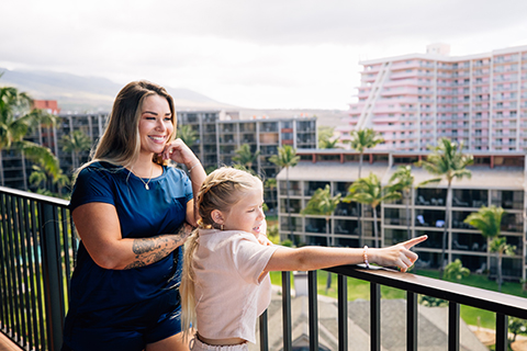 Woman and daughter on balcony