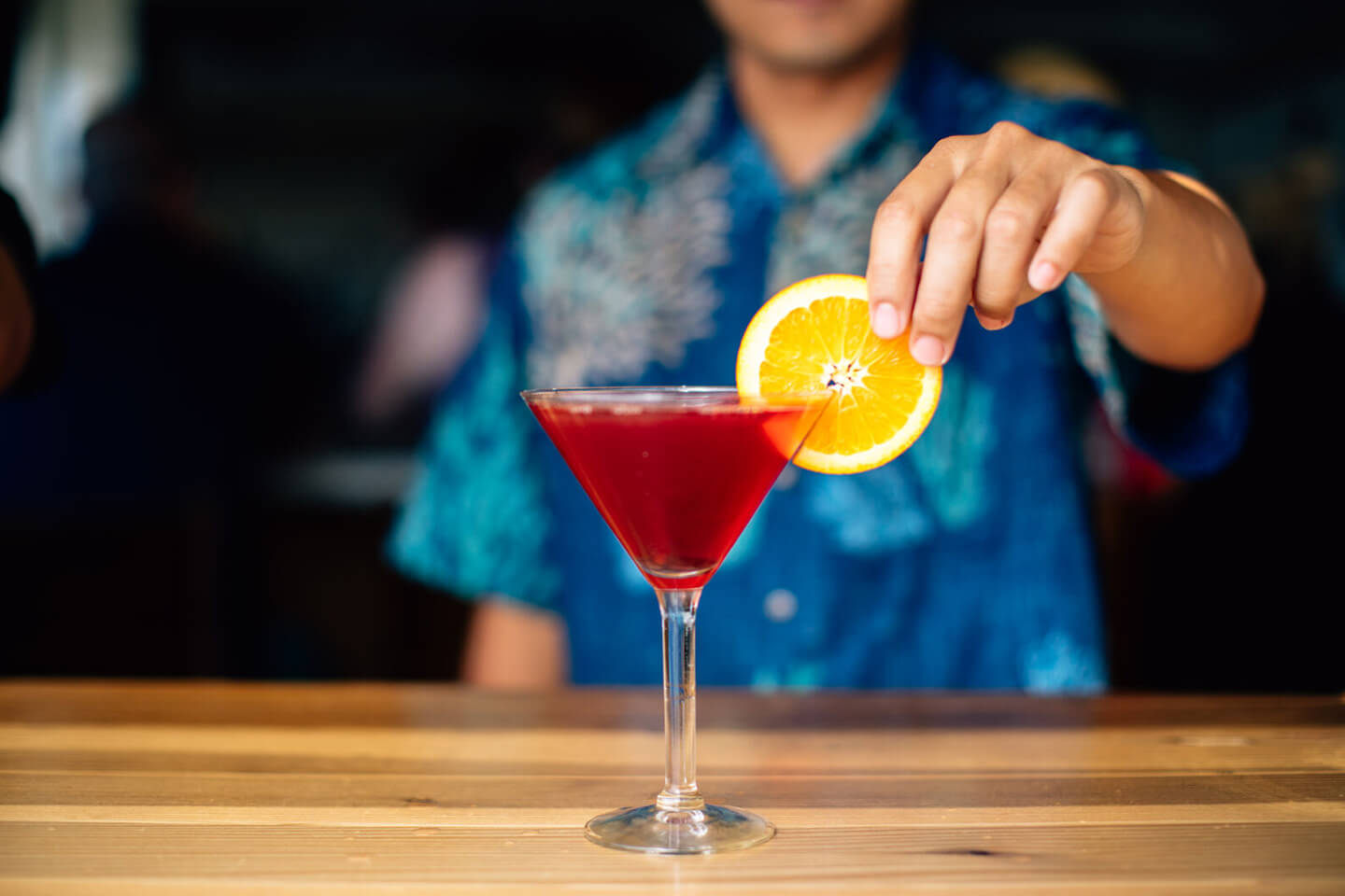Bartender making a cocktail.