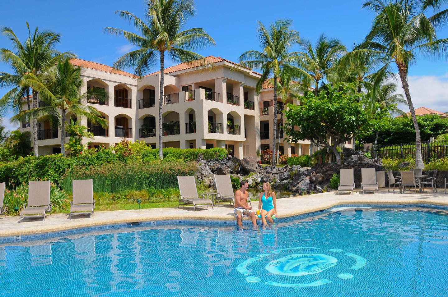 Couple relaxing at pool