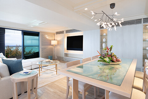 Dining room with table, chairs, and living area