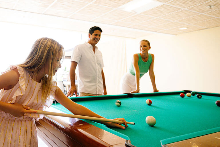 Family playing pool
