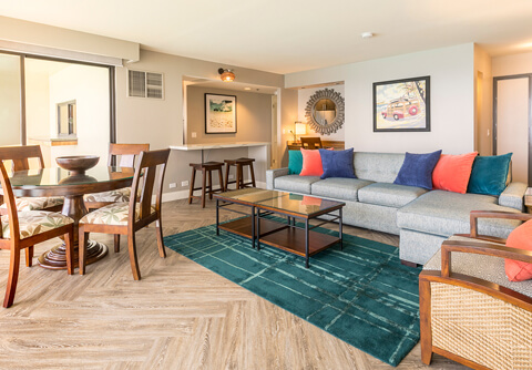 Living room with dining area, couches, coffee table