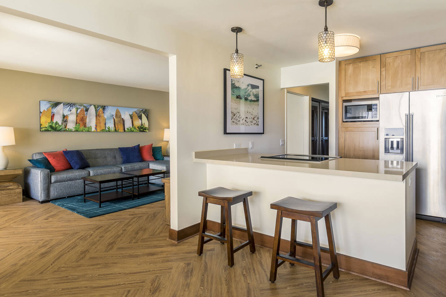 Living area and kitchen with countertop seating.