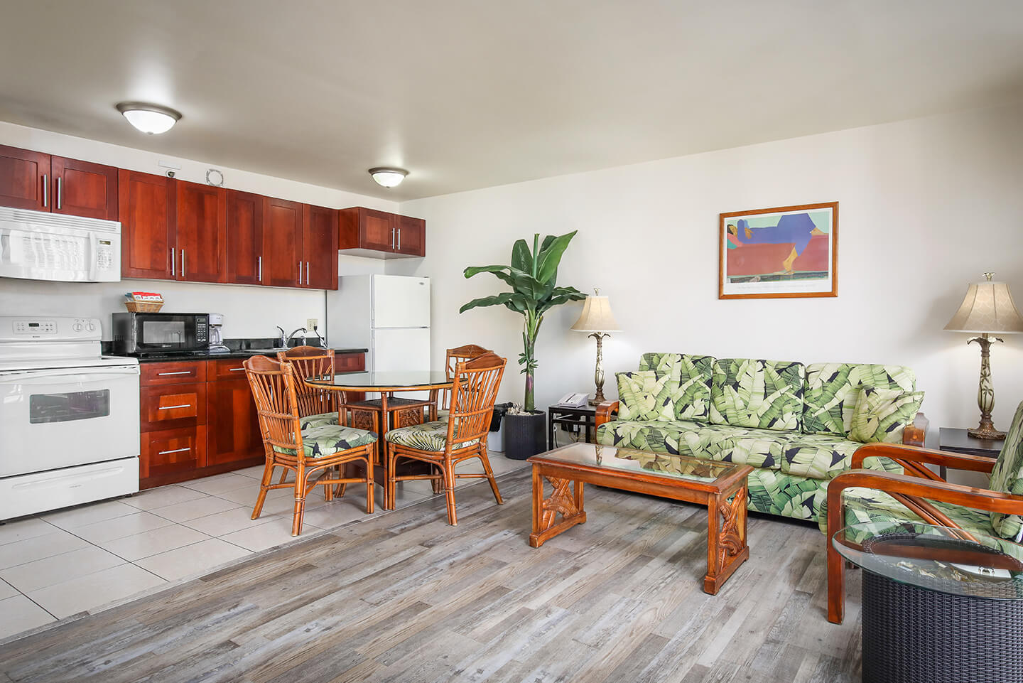 1-Bedroom Standard  living area with sofa, fully equipped kitchen, and dinning area.