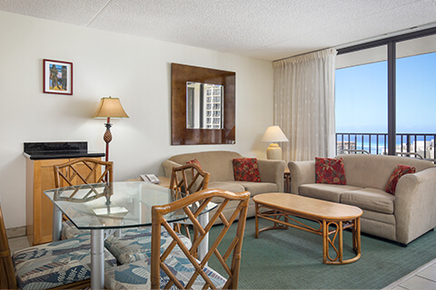 1-Bedroom Superior Suite living area with view.