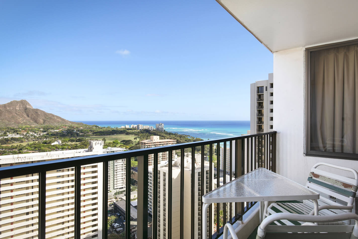 1-Bedroom Deluxe Ocean View bedroom view from private balcony with stunning ocean view.