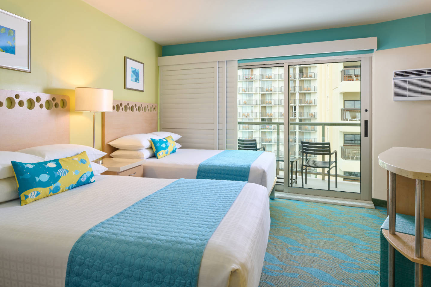 Room with 2 beds, nightstand, lamps, dresser, TV, and balcony.