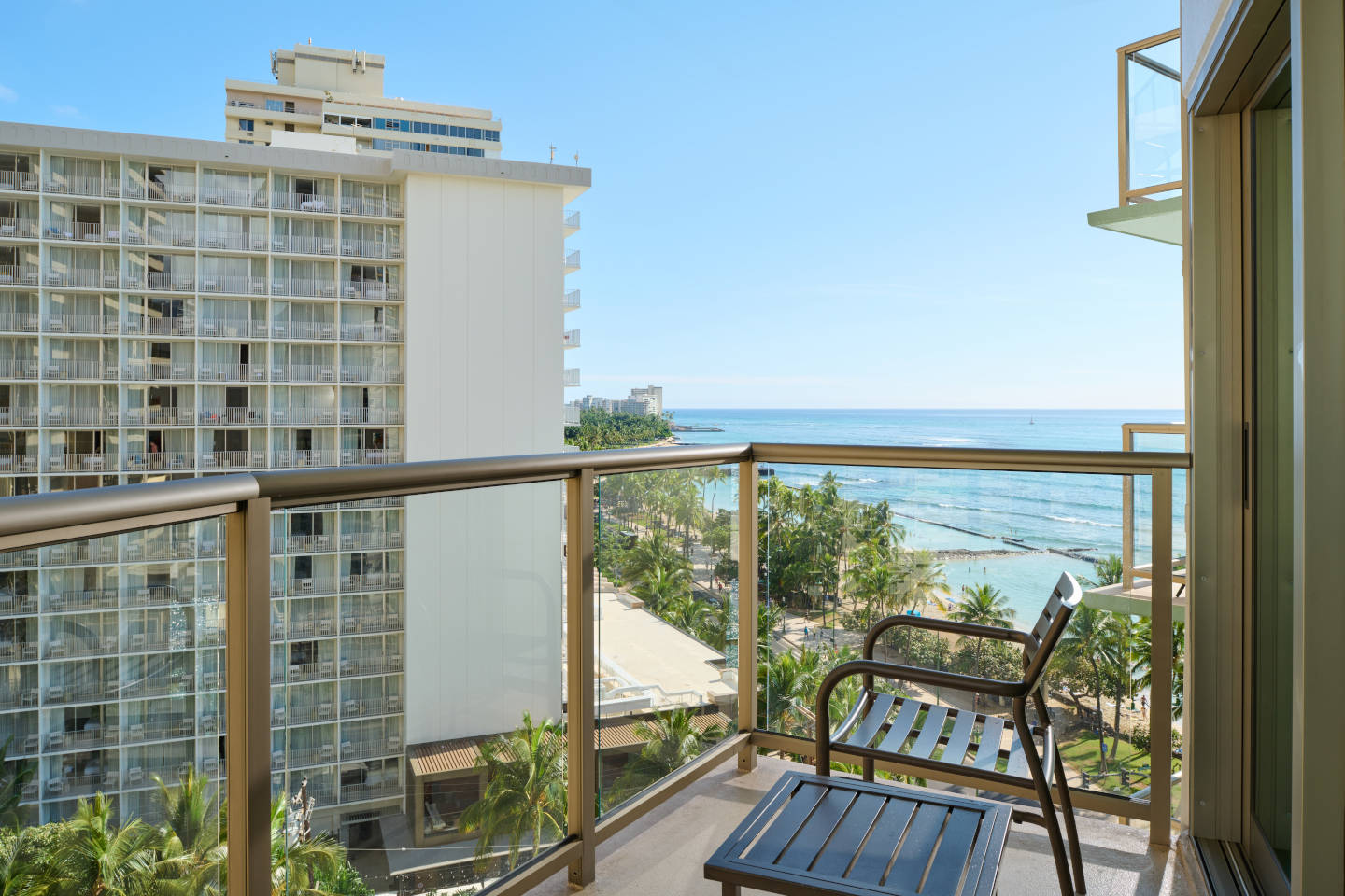 Partial Ocean View Room Balcony and seating with views of the ocean.