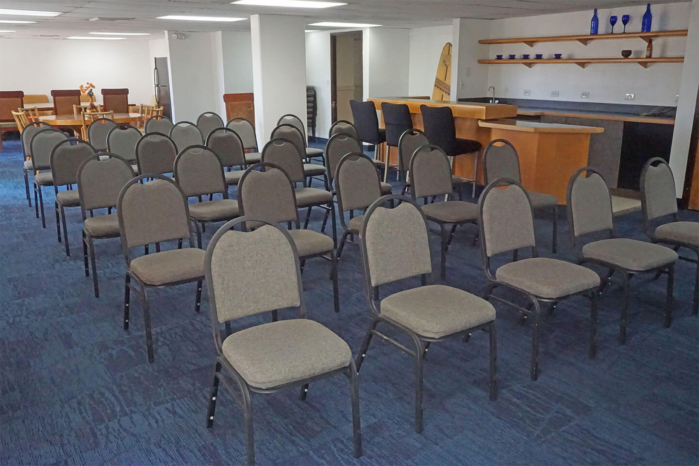 Meeting room with chairs and a wetbar area.