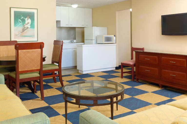 3-Bedroom 3-Bath Penthouse living area with kitchenette and mini refrigerator