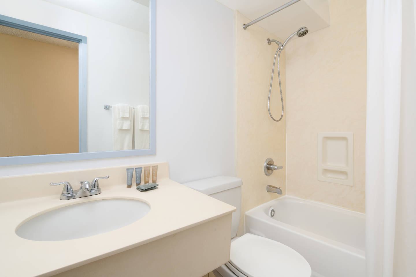 Bathroom with a sink, toilet, and shower/tub combo.