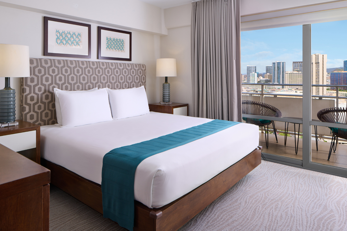 Bed, nightstands, lamps, and balcony.