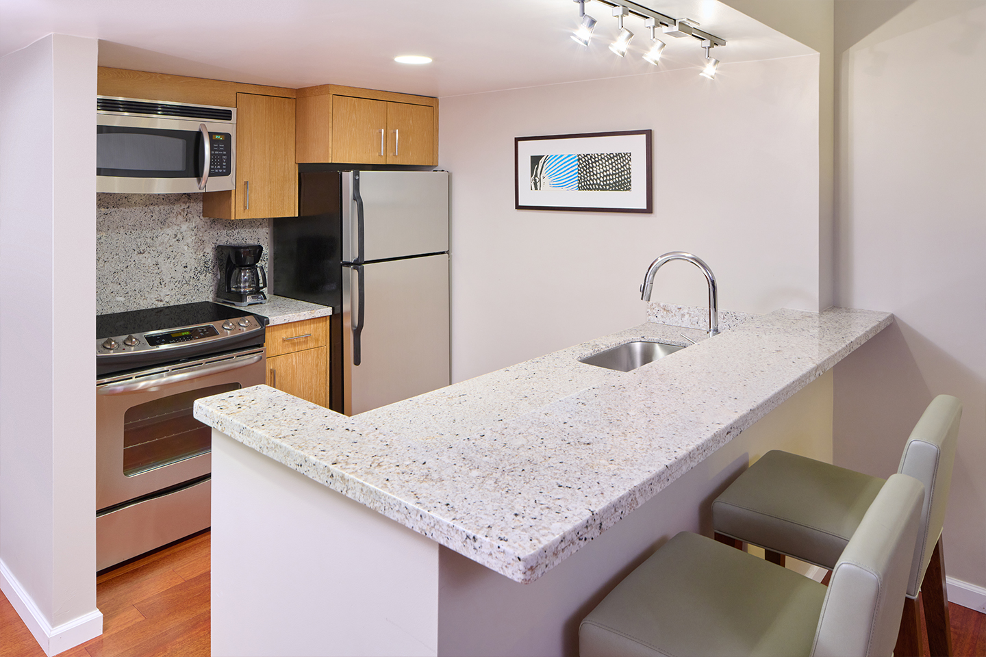 Kitchen with counter top and seats