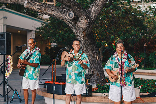 Musicians performing on open-air deck.