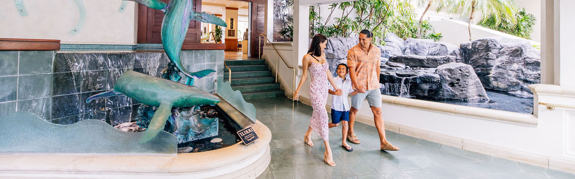 Family walking through hotel entrance.