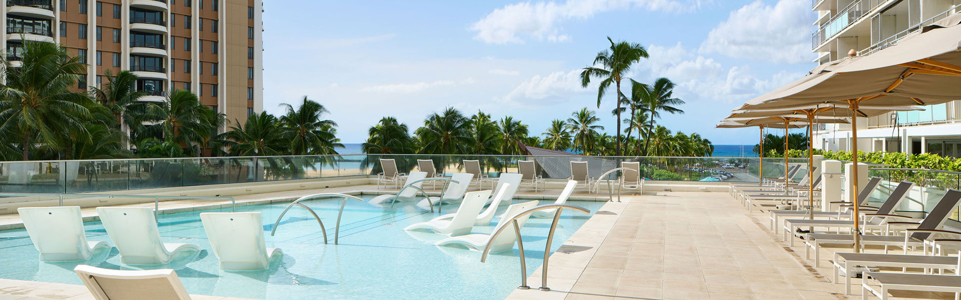Pool and sun deck with in-water loungers.