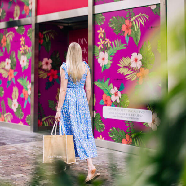 Woman shopping at outdoor mall.