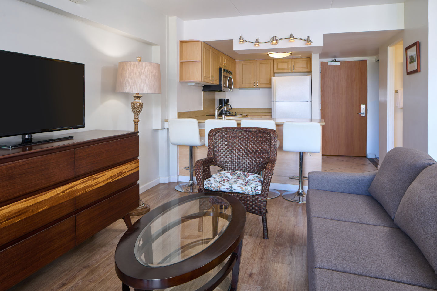 Ilikai Lite Mountain View Jr Suite Living area with LCD TV, separate seating area, and lighting