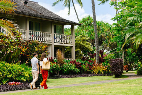Couple walking through resort grounds