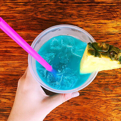 Blue cocktail drink with a pineappple