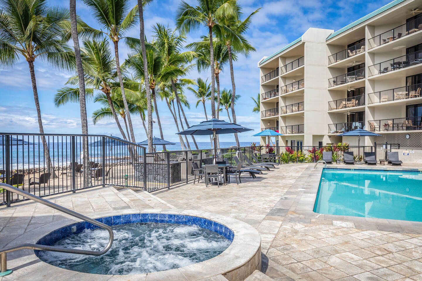 Oceanfront hot tub whirlpool on pool deck.