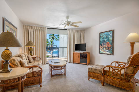 One-Bedroom Ocean View Living space with sofa and matching lounge chair