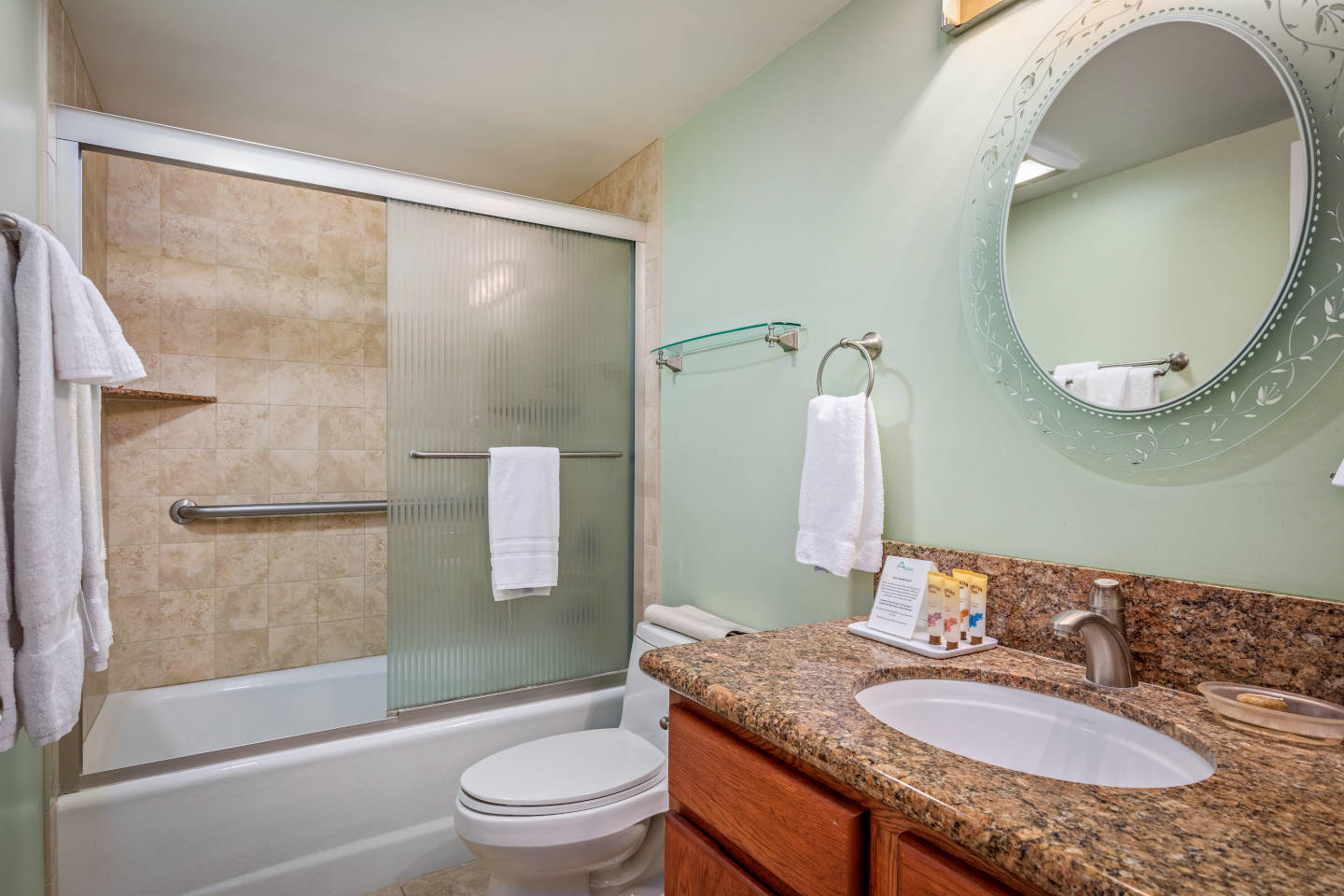 Bathroom with shower/tub, toilet, sink.