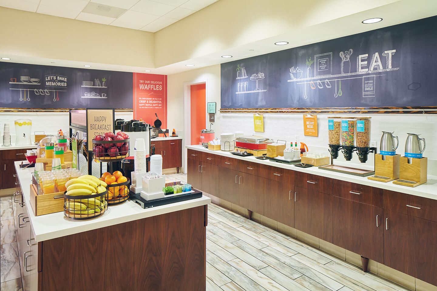 Room with continental breakfast and some hot foods