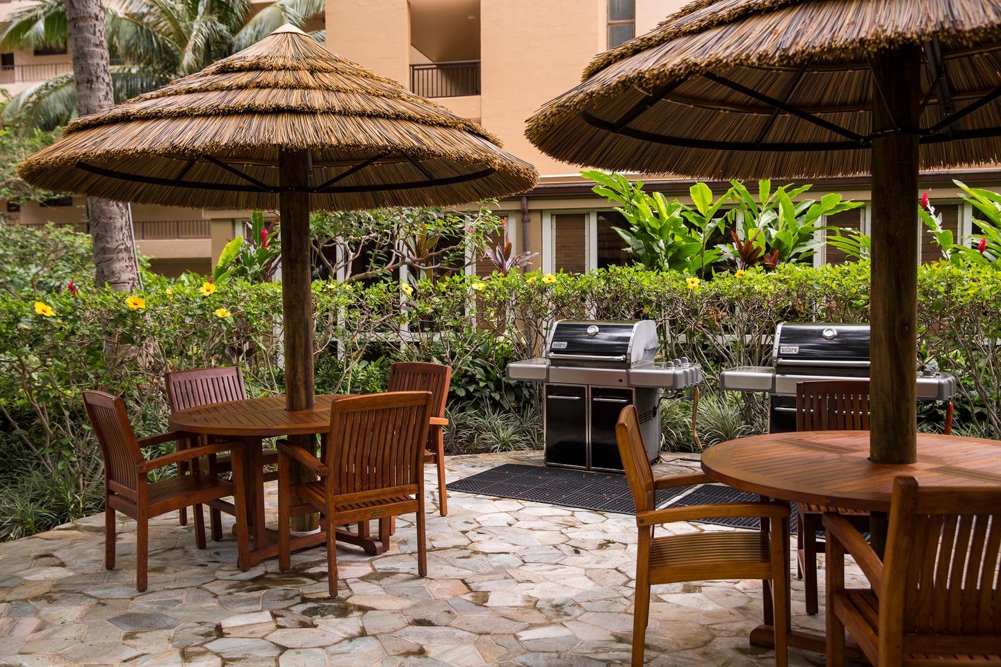 Outdoor barbecue grills and tables with chairs.