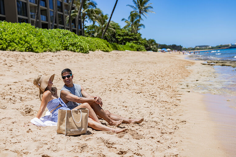 Couple relaxing on beach.
