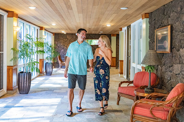 Couple walking through lobby.