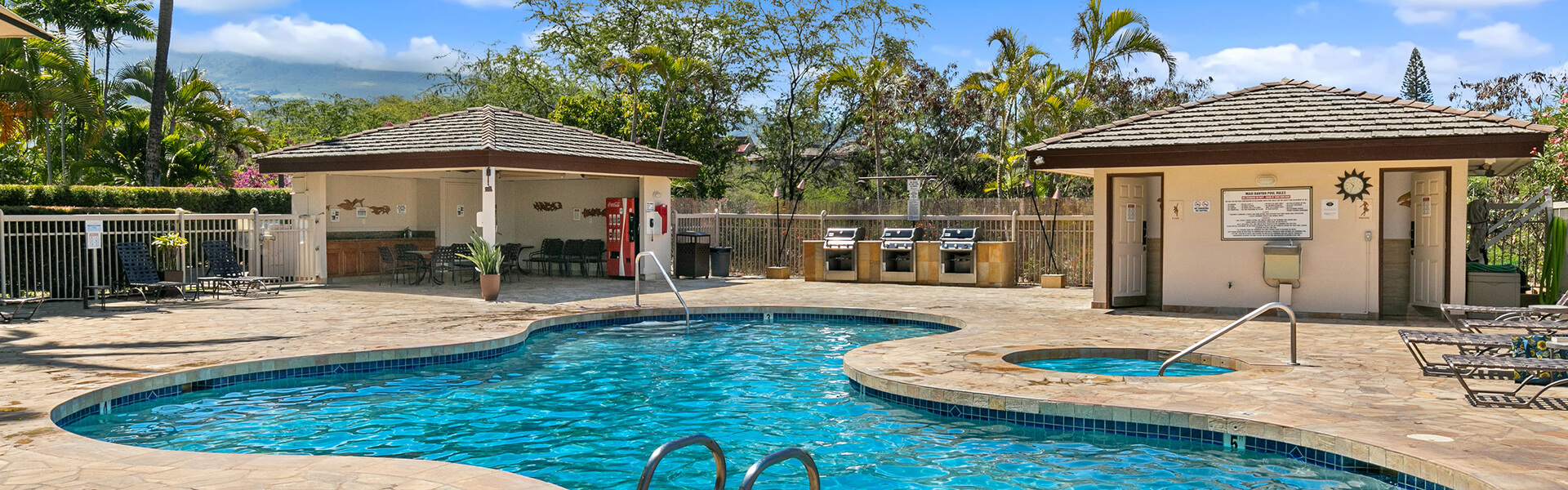 Pool and sun deck with loungers, grills, pavillion, restrooms, and a hot tub.
