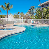 Outdoor swimming pool, hot tub, and sun deck