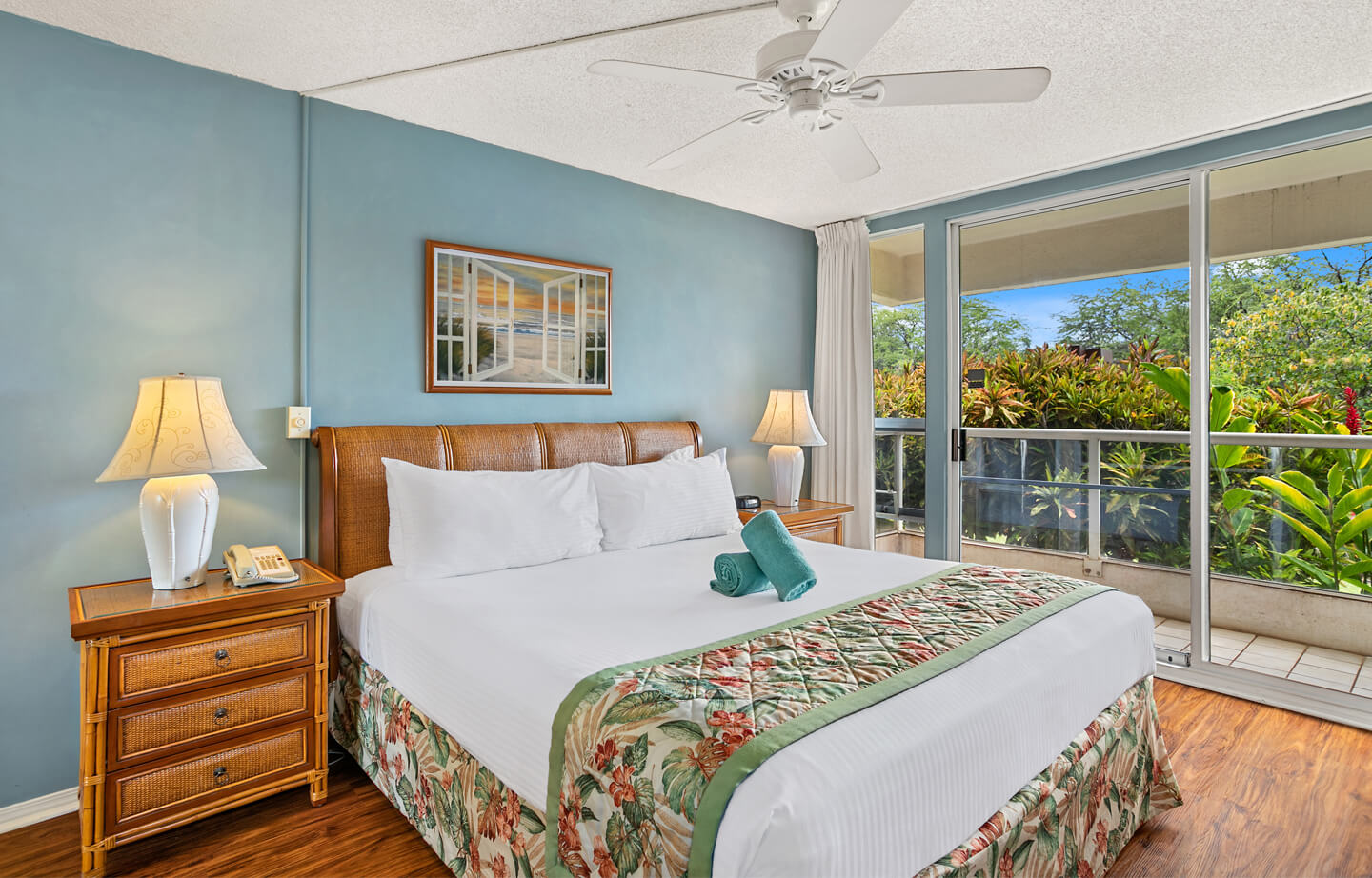 Room with bed, night stand, lamp, balcony.