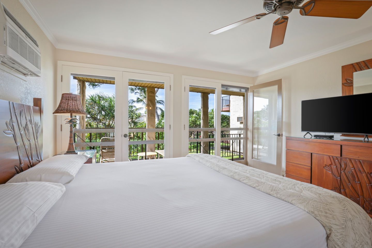 Two-Bedroom Garden View Bedroom with a view, nightstand, dresser with a television