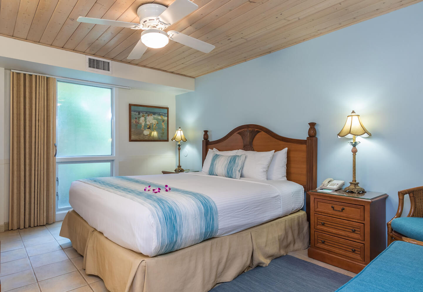 Room with a bed, nightstand, and lamps.