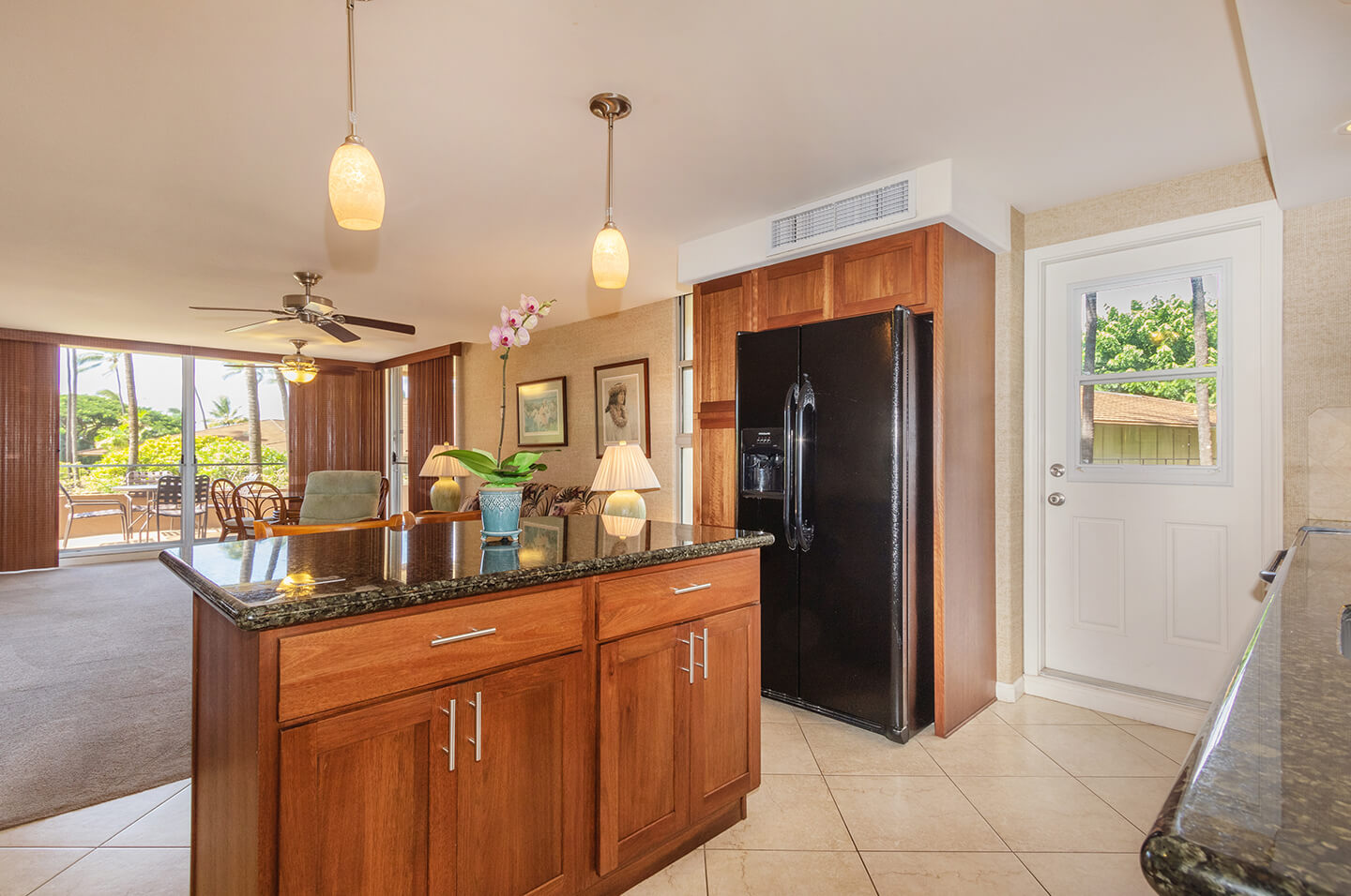 Kitchen view into dining and living area.