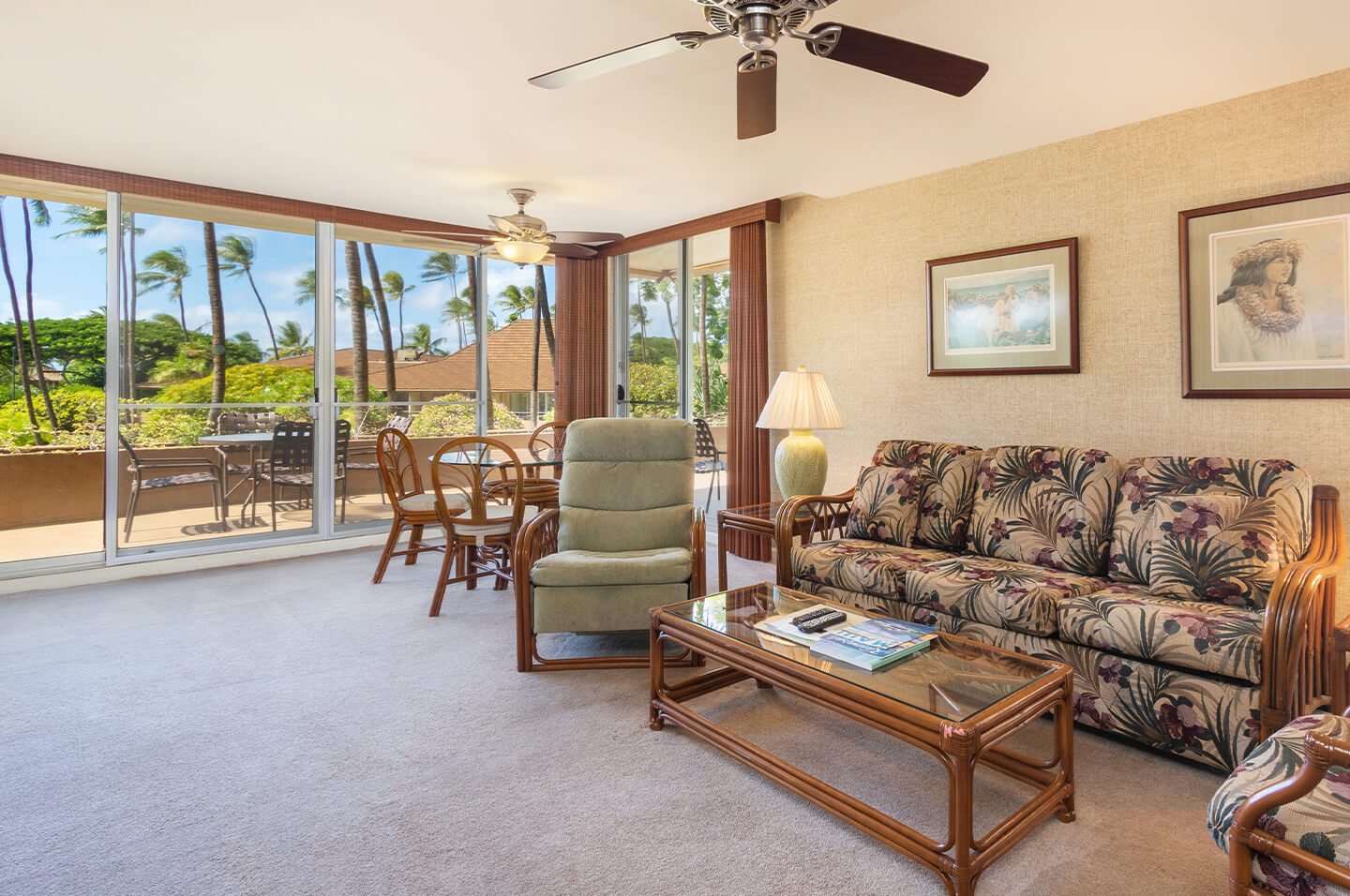 Living area with a couch, coffee table, and balcony.