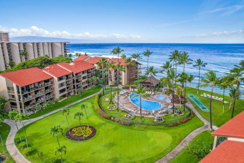 Aerial view of the resort's grounds with swimming pool, bbq area and ocean